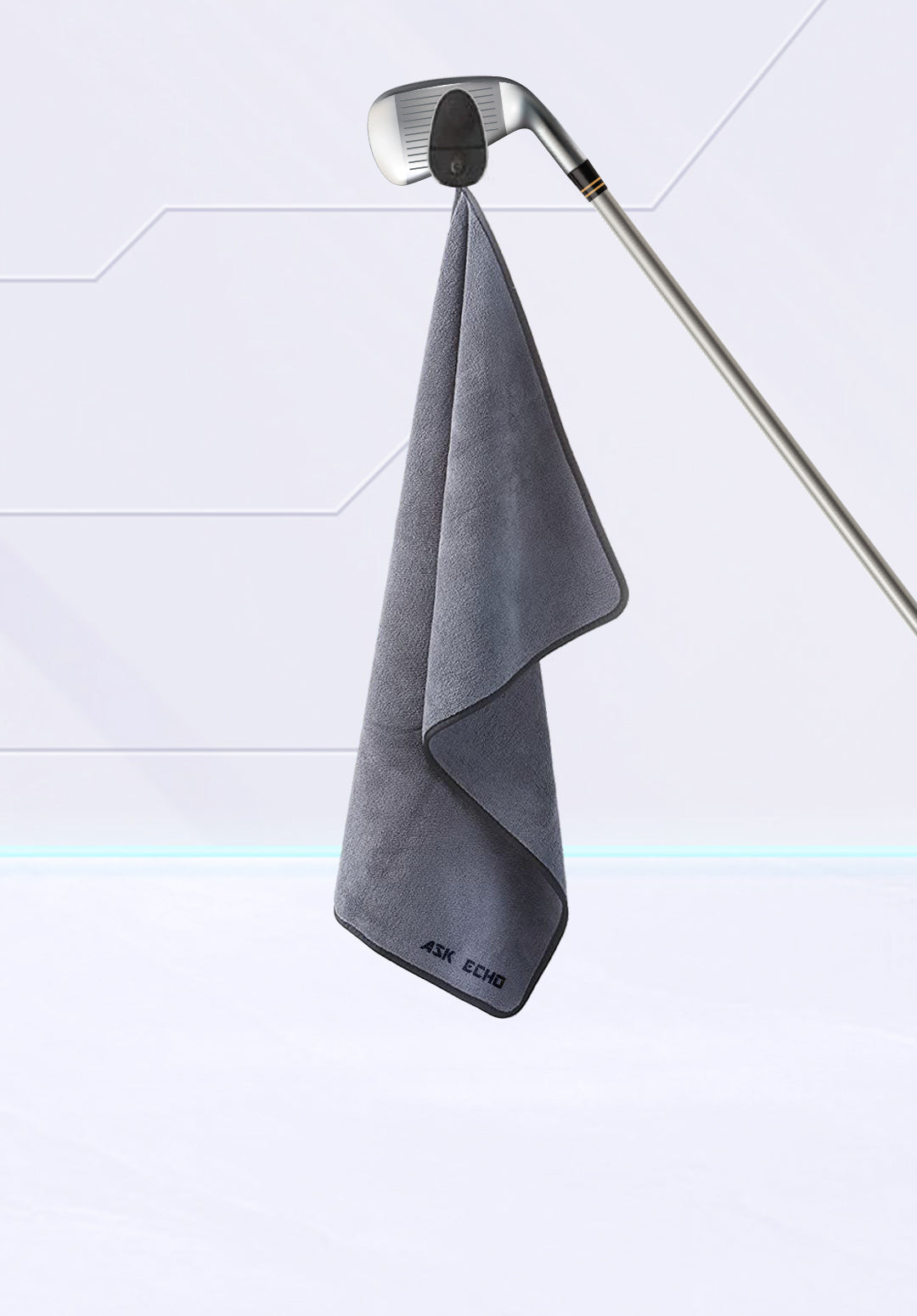 ASK ECHO golf accessory magnetic towel in grey hanging on club, designed for quick cleaning on the course
